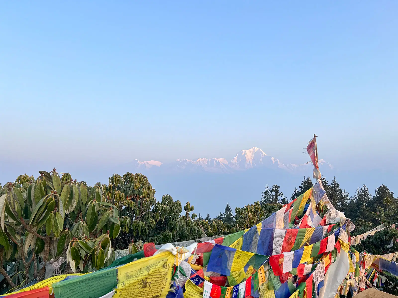 Nepal Flags with Snow-capped Himalayan mountains at sunrise