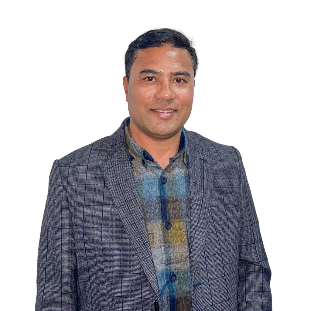 Dharma Kumar Shrestha - General Manager at NEVI wearing a blue checked shirt and mid blue jacket