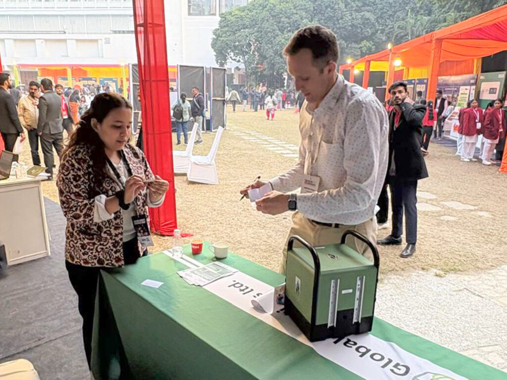 David talking to Lady from TERI at the Sankalp Bharat event in India