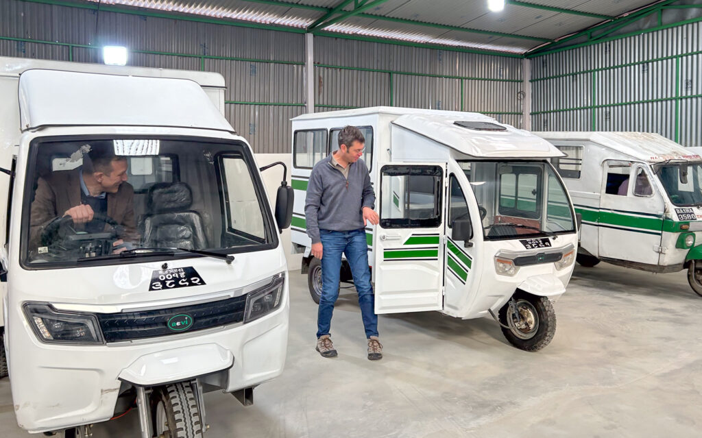 Philip and David inspecting the EV Rickshaws at the NEVI factory, Nepal