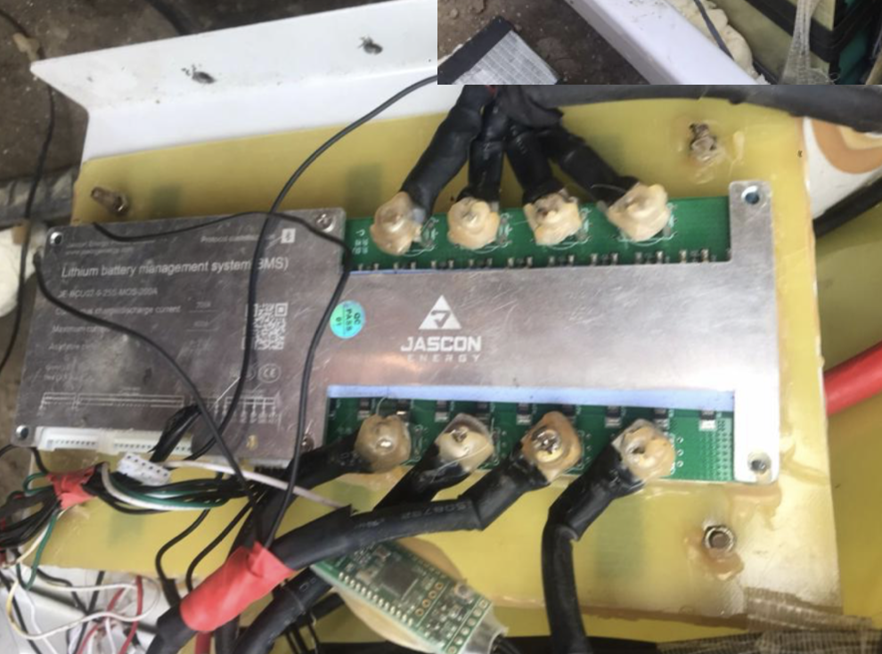 Close-up showing poor terminal connections on an existing battery system in Nepal
