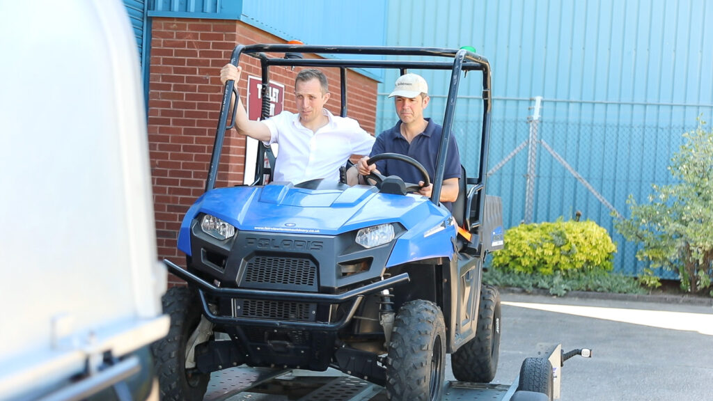 David Tetlow and Philip Tyler loading the blue Polaris onto the trailer ready to take to UK Pilot Site