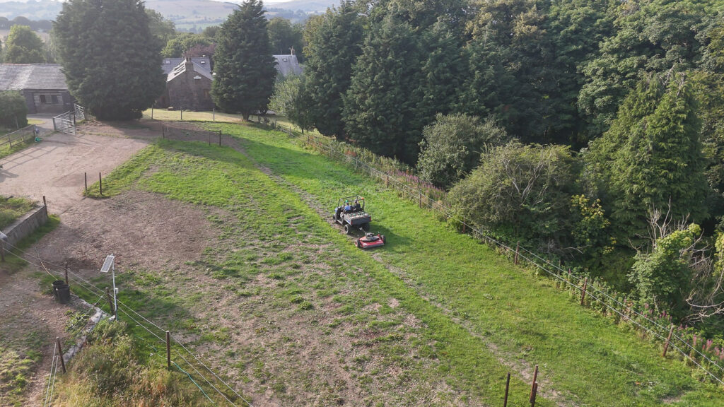 Overhead view of the Polaris and mower with two of the Global solutions team in at the UK Pilot Site.